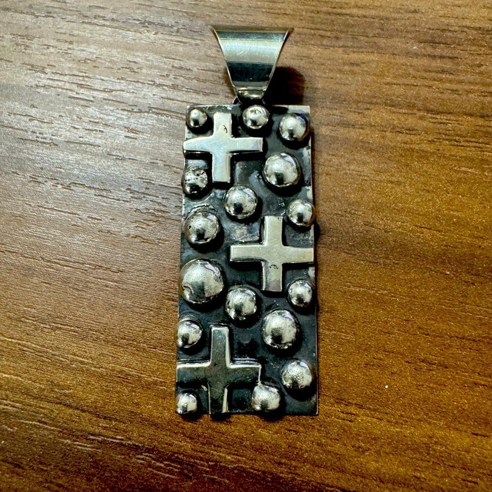 Native made Chimney Butte sterling silver cross/dot pendant